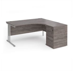 Maestro 25 right hand ergonomic desk 1600mm with silver cantilever frame and desk high pedestal - grey oak