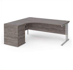 Maestro 25 left hand ergonomic desk 1800mm with silver cantilever frame and desk high pedestal - grey oak