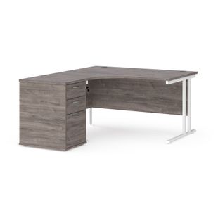 Maestro 25 left hand ergonomic desk 1400mm with white cantilever frame and desk high pedestal - grey oak