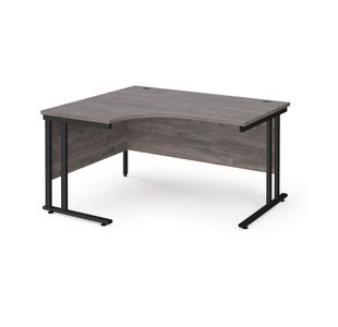 Maestro 25 left hand ergonomic desk 1400mm wide - black cantilever leg frame, grey oak top