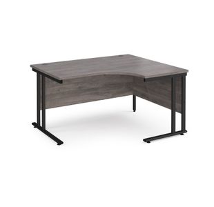 Maestro 25 right hand ergonomic desk 1400mm wide - black cantilever leg frame, grey oak top