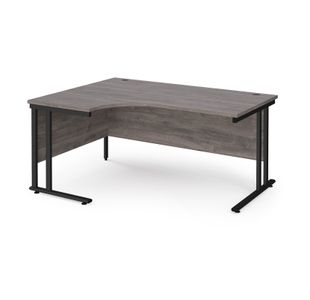 Maestro 25 left hand ergonomic desk 1600mm wide - black cantilever leg frame, grey oak top