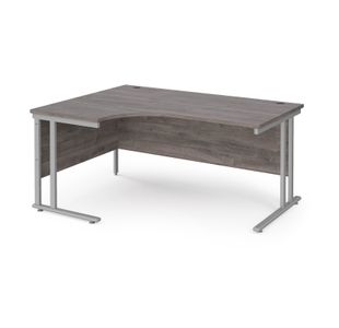 Maestro 25 left hand ergonomic desk 1600mm wide - silver cantilever leg frame, grey oak top