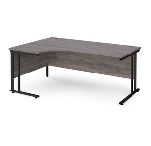 Maestro 25 left hand ergonomic desk 1800mm wide - black cantilever leg frame, grey oak top